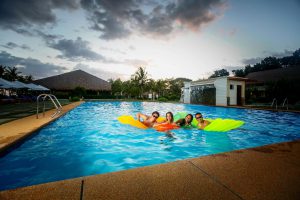 Family enjoying the swimming pool
